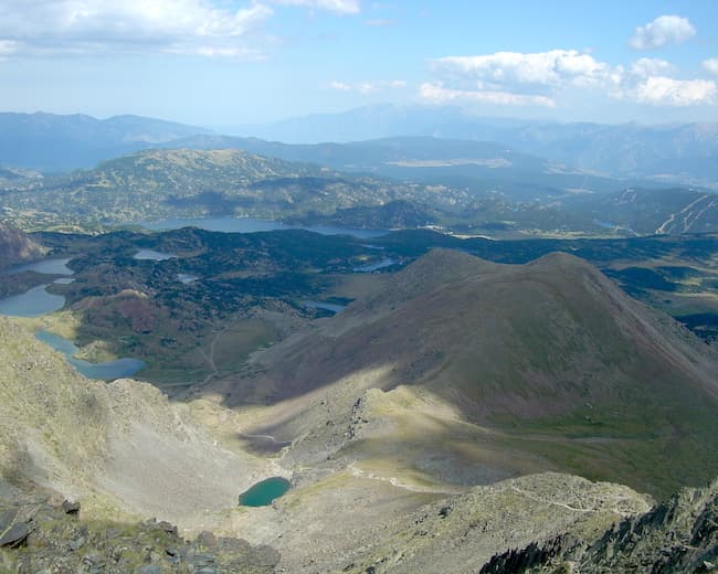 A magnificent view in the summer from Pic Carlit overlooking the numerous high-altitude lakes below.